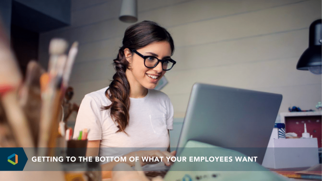Getting to the Bottom of What Your Employees Want - happy woman looking at her computer